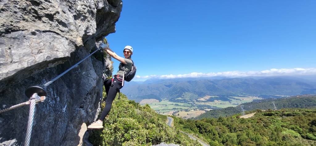 Climber on Takaka Hill via ferrata